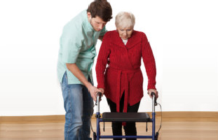 Man assisting elderly woman